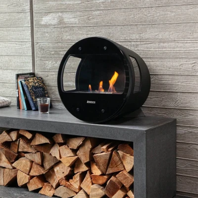 Aduro B1 tabletop bioethanol fireplace in black, featuring a sleek and modern design.