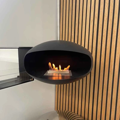 Cocoon Aeris Black with Steel Mounting Pole – a modern ceiling-mounted bioethanol fireplace with a sleek black finish and durabl