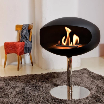 Cocoon Pedestal Matte Black with Steel Pedestal - A modern floor-standing bioethanol fireplace with a sleek design and stainless