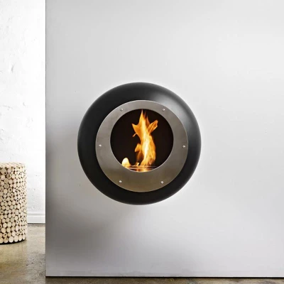 Cocoon Vellum Matte Black Bioethanol Fireplace | Buy Now Cocoon Vellum Matte Black wall-mounted bioethanol fireplace with sleek modern design and 3 kW heat output.
