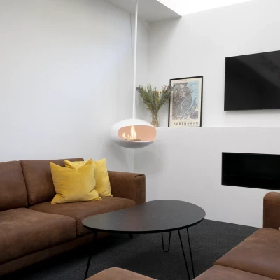 Cocoon Aeris White ceiling-mounted bioethanol fireplace with a sleek, modern design and clean-burning flame.