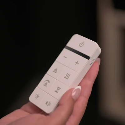 Dimplex Ignite Ultra 60 electric fireplace with multi-sided installation and remote control.