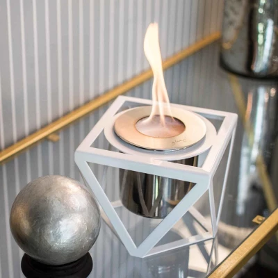 GlammFire Alquimia White tabletop bioethanol fireplace with a sleek modern design and compact size.