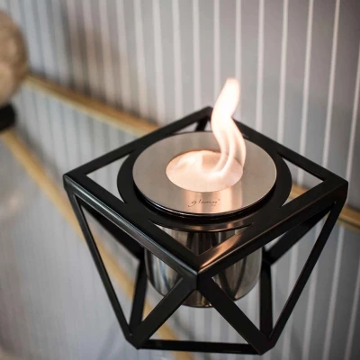 GlammFire Alquimia Black tabletop bioethanol fireplace with sleek design and manual control, offering a 3-hour burn time.