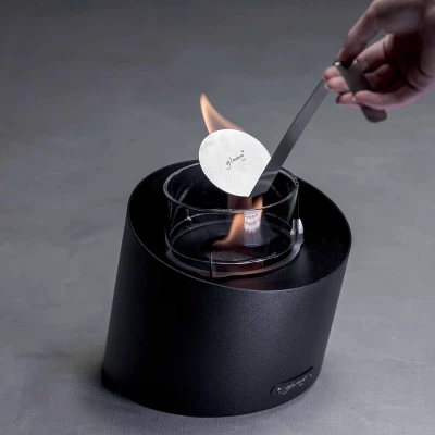 Contour Table Fireplace - Black by GlammFire, a sleek and modern bioethanol tabletop fireplace with a 20 cm length and 3-hour bu