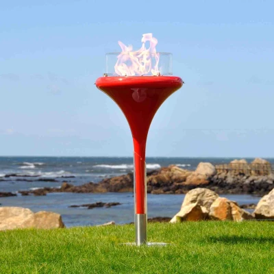 Flut - Red bioethanol fire pit by GlammFire, a stylish outdoor heating solution with a bold red finish.