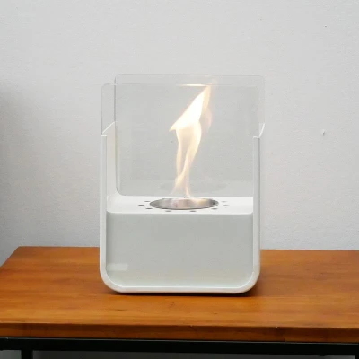 ScandiFlames white tabletop bioethanol fireplace made of steel, featuring a sleek and modern design.