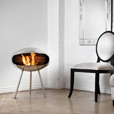 Cocoon Terra Polished Steel Bioethanol Fireplace with Steel Legs - Elegant and modern floor-standing design.