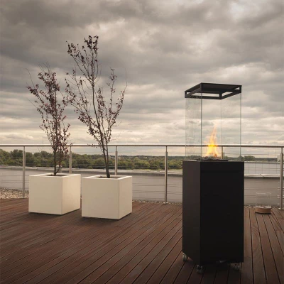 Lighthouse Outdoor Fireplace in black with manual control, designed for outdoor heating and ambiance.