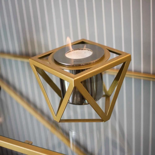 Alquimia - Golden tabletop bioethanol fireplace by GlammFire with a luxurious gold finish.