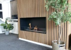 Foco One 1200 bioethanol fireplace with black finish, designed for built-in one-sided installation.