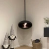 Cocoon Aeris Matte Black with Black Rod – a ceiling-mounted bioethanol fireplace with a sleek matte black finish and modern desi