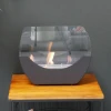 Cradle Table Bio Fireplace - Black by ScandiFlames, a modern tabletop bioethanol fireplace with a sleek black finish and 5-hour 