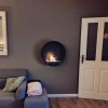 Delaware Black Round Wall Mounted Biofireplace by ScandiFlames - A modern, space-saving bioethanol fireplace with a sleek black 