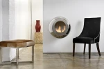Cocoon Vellum Polished Steel wall-mounted bioethanol fireplace with a sleek and modern design.