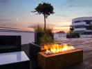 Galio Corten - Automatic outdoor gas fireplace with a rusted corten steel finish, app and remote-controlled operation.