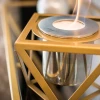 Alquimia - Golden tabletop bioethanol fireplace by GlammFire with a luxurious gold finish.