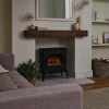 Hinton Cast Iron Electric Fireplace by British Fires in black, featuring a freestanding cast iron design with remote and panel c