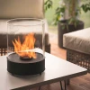 Chantico Glassfire tabletop bioethanol fireplace in black with glass panels, offering modern design and efficient heating.