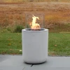Planika Jar with Concrete Base – Stylish freestanding bioethanol fireplace in white with a concrete base for outdoor use.
