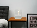 ScandiFlames white tabletop bioethanol fireplace made of steel, featuring a sleek and modern design.