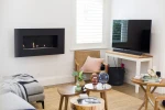 Icon Fires Nero 1150 Wall Fire in black, a sleek and modern wall-mounted bioethanol fireplace with 8-hour burn time and 5.4 kW h