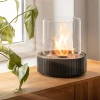 Planika Lotus tabletop bioethanol fireplace in black with a sleek, modern design, offering 3.5 hours of burn time and 2.5 kW hea