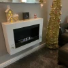Nebraska White Wall-Mounted Biofireplace by ScandiFlames, a sleek and modern bioethanol fireplace with a white finish.