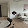 Cocoon Aeris Matte Black with Black Rod – a ceiling-mounted bioethanol fireplace with a sleek matte black finish and modern desi