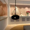 Cocoon Aeris Matte Black with Black Rod – a ceiling-mounted bioethanol fireplace with a sleek matte black finish and modern desi