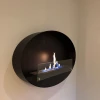 Maryland Oval Wall Hanging Slim Fireplace by ScandiFlames – a sleek and modern black bioethanol wall-mounted fireplace.