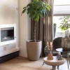 Nebraska White Wall-Mounted Biofireplace by ScandiFlames, a sleek and modern bioethanol fireplace with a white finish.