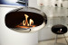 Cocoon Aeris Polished Steel ceiling-mounted bioethanol fireplace with a sleek steel pole, offering modern elegance and efficient