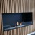 Foco One 1000 bioethanol fireplace by FOCO Fires, a sleek built-in one-sided fireplace with remote control and black finish.