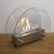 ScandiFlames Circular Table Bio Fireplace in steel with a stylish glass frame for tabletop use.