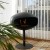 Cocoon Pedestal - Black with a Black Base, a freestanding bioethanol fireplace with a modern design and eco-friendly heating.