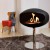Cocoon Pedestal Matte Black with Steel Pedestal - A modern floor-standing bioethanol fireplace with a sleek design and stainless