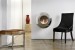 Cocoon Vellum Polished Steel wall-mounted bioethanol fireplace with a sleek and modern design.