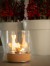 Dancing Flames Table Fireplace in cork finish, featuring a stylish design with a real flame effect and a manual control system.