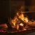 Faber e-Matrix Mood 800-500 II built-in corner vapour fireplace with Opti-myst flame effect, smart controls, and a modern black 
