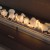 Tray of White Ceramic Stones by Planika, a premium decorative accessory for bioethanol fireplaces.