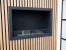 Foco One 800 bioethanol fireplace by FOCO Fires – a sleek, built-in one-sided fireplace with remote and manual control, offering