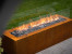 Galio Corten outdoor gas fireplace with rust-finish and manual control.