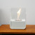 ScandiFlames white tabletop bioethanol fireplace made of steel, featuring a sleek and modern design.