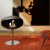 Cocoon Pedestal Matte Black with Steel Pedestal - A modern floor-standing bioethanol fireplace with a sleek design and stainless