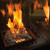 Lighthouse Outdoor Fireplace in black with manual control, designed for outdoor heating and ambiance.