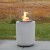 Planika Jar with Concrete Base – Stylish freestanding bioethanol fireplace in white with a concrete base for outdoor use.