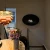 Maryland Oval Wall Hanging Slim Fireplace by ScandiFlames – a sleek and modern black bioethanol wall-mounted fireplace.