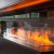 Mistero 2000 Water Vapour Fireplace by Magic Fire by Safretti – a sleek, two-sided Opti-myst built-in fireplace with a realistic