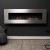 Icon Fires Nero 1750 Wall Fire in brushed steel – a modern wall-mounted bioethanol fireplace with 9.8 kW heat output and manual 